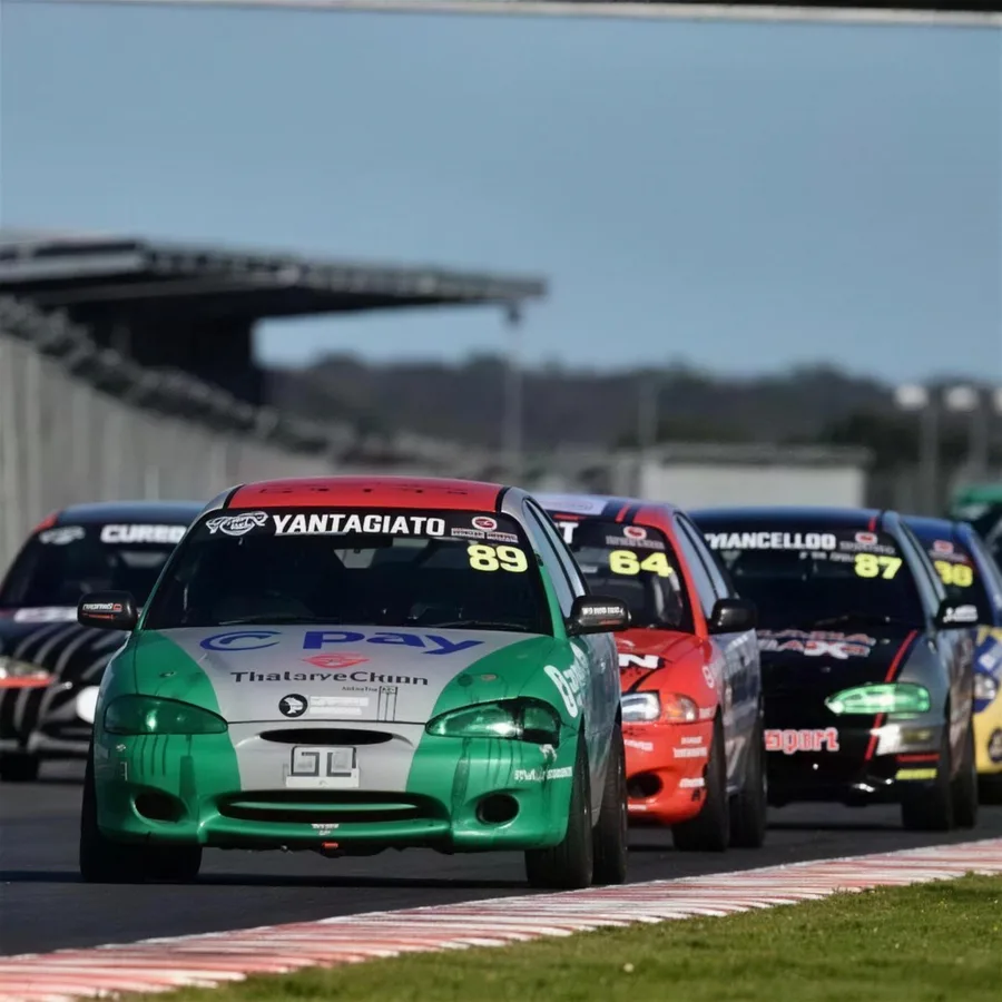 Car 89 leading a pack of Circuit Excel cars into a corner